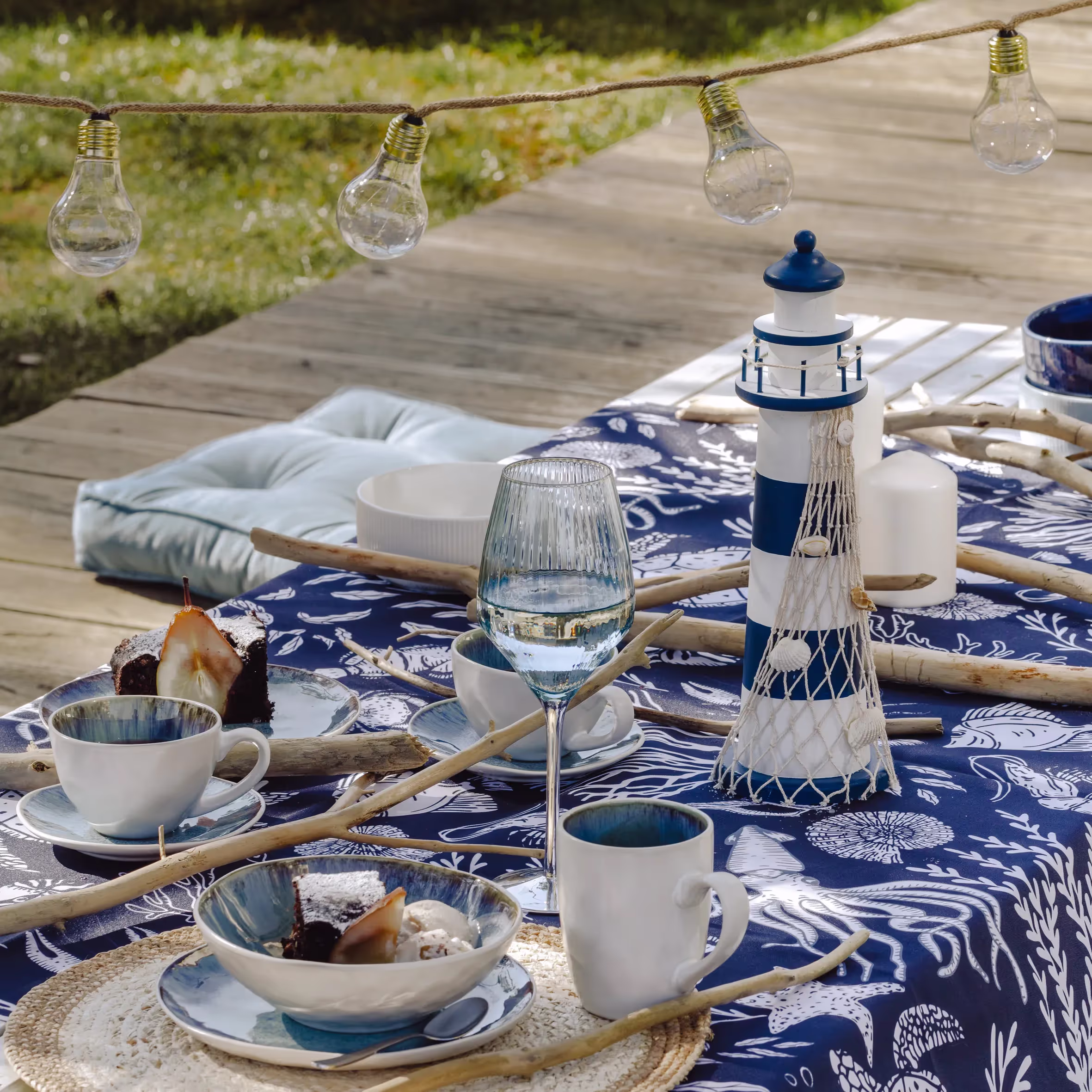 A table topped with plates and bowls filled with food.
